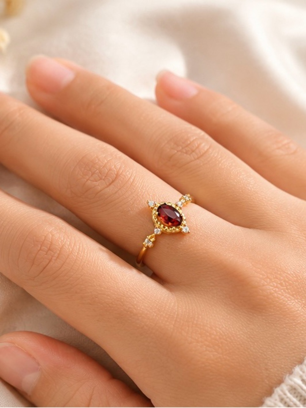 Gold Ring with Garnet Red Center and Diamond Accents